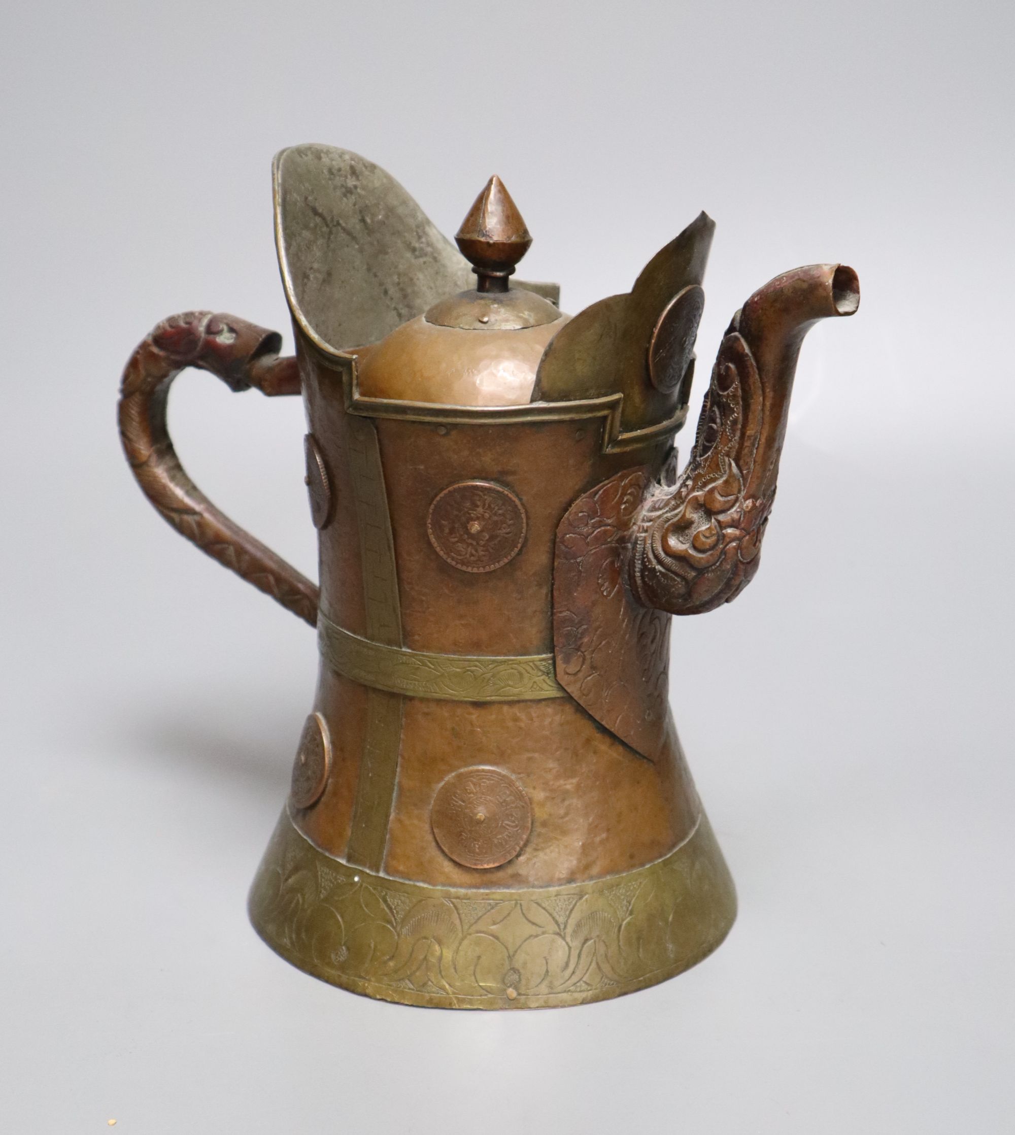 A Himalayan copper and brass teapot, height 20cm
